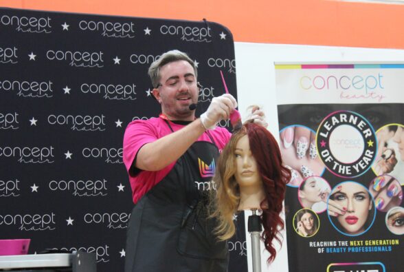 Jack Barney, Assistant Regional Education Developer, Matrix answers students' quesions while applying hair colour