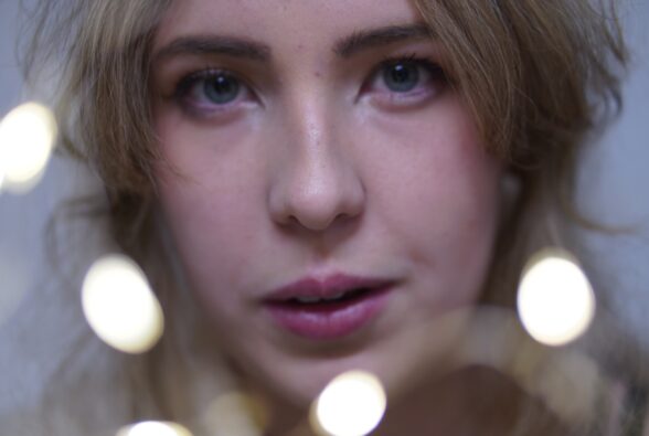 Bokeh style image of Photography student Mia Hales by a student photographer