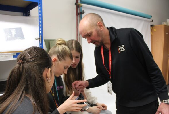 Sam Pilling, Technical Training Manager at Sony Europe shows Photography Student Emily Voyce how to set the camera to create a Bokeh style image